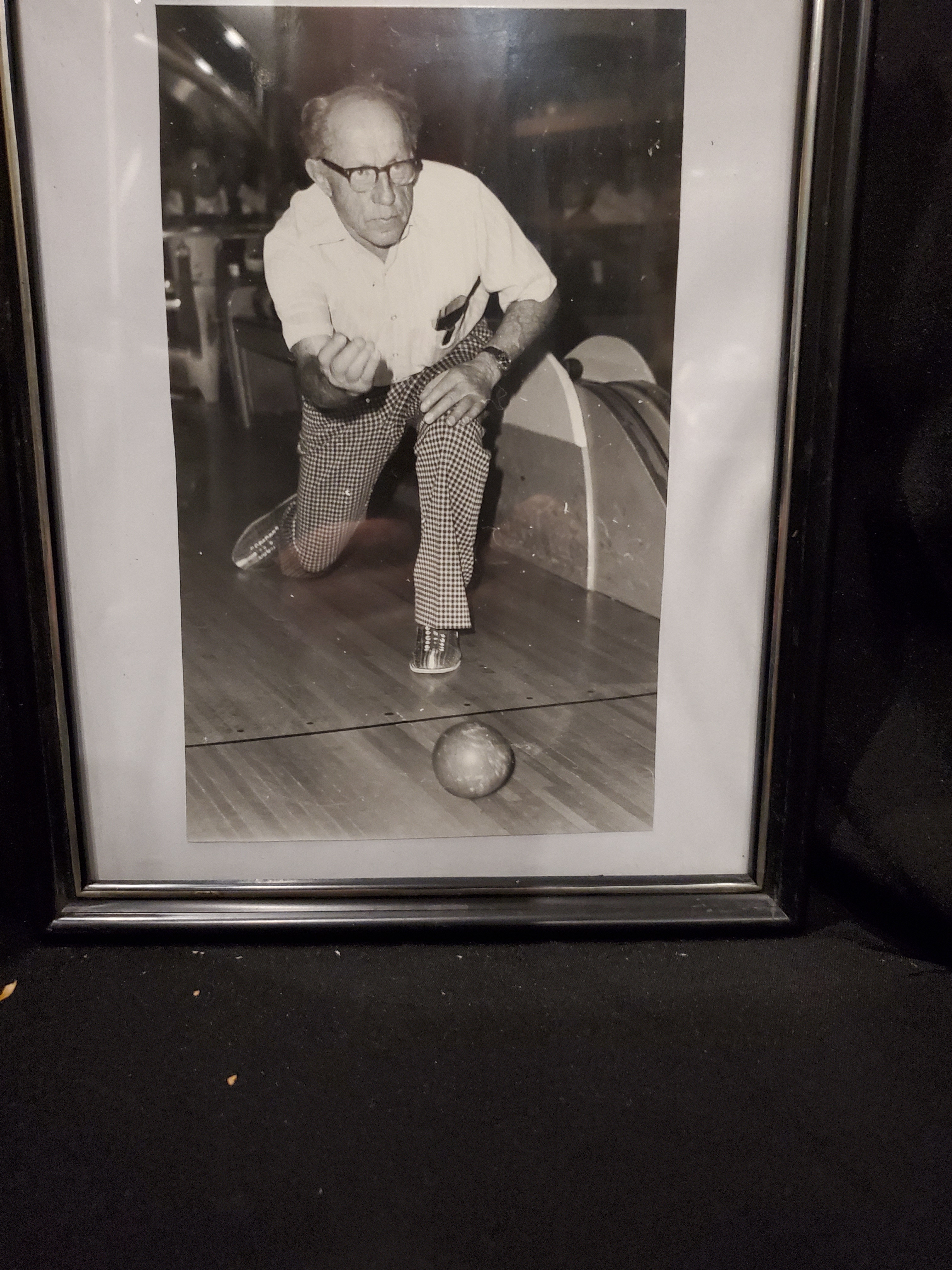 Male bowler delivering 5 pin ball down alley