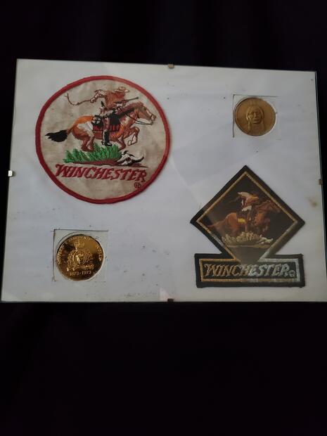 Winchester items on pressboard-2 crests & 2 inlays