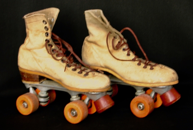 Roller skates with orange nylon wheels